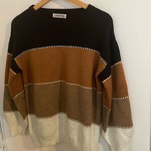 Cute sweater with larger sleeves! Black, brown, and white. Size M.